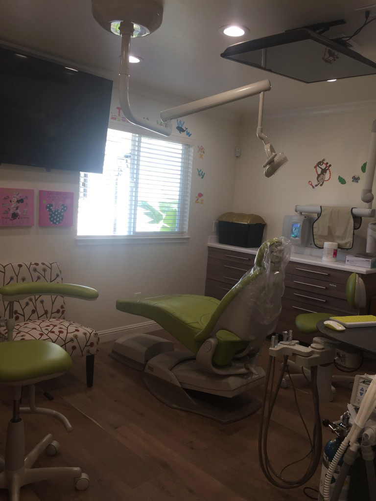 iSmile Dental office exam room with television and large window