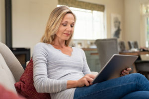 A lady on her tablet.