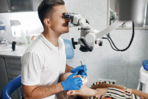 Dentist performing an exam on a patient.