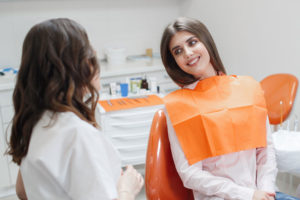 Dentist speaking with a patient.