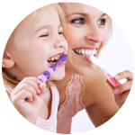 Mother & child Enjoying Brushing Their Teeth